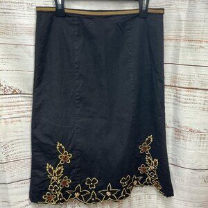 Filo women’s black skirt. Side zip with beaded floral design on front.